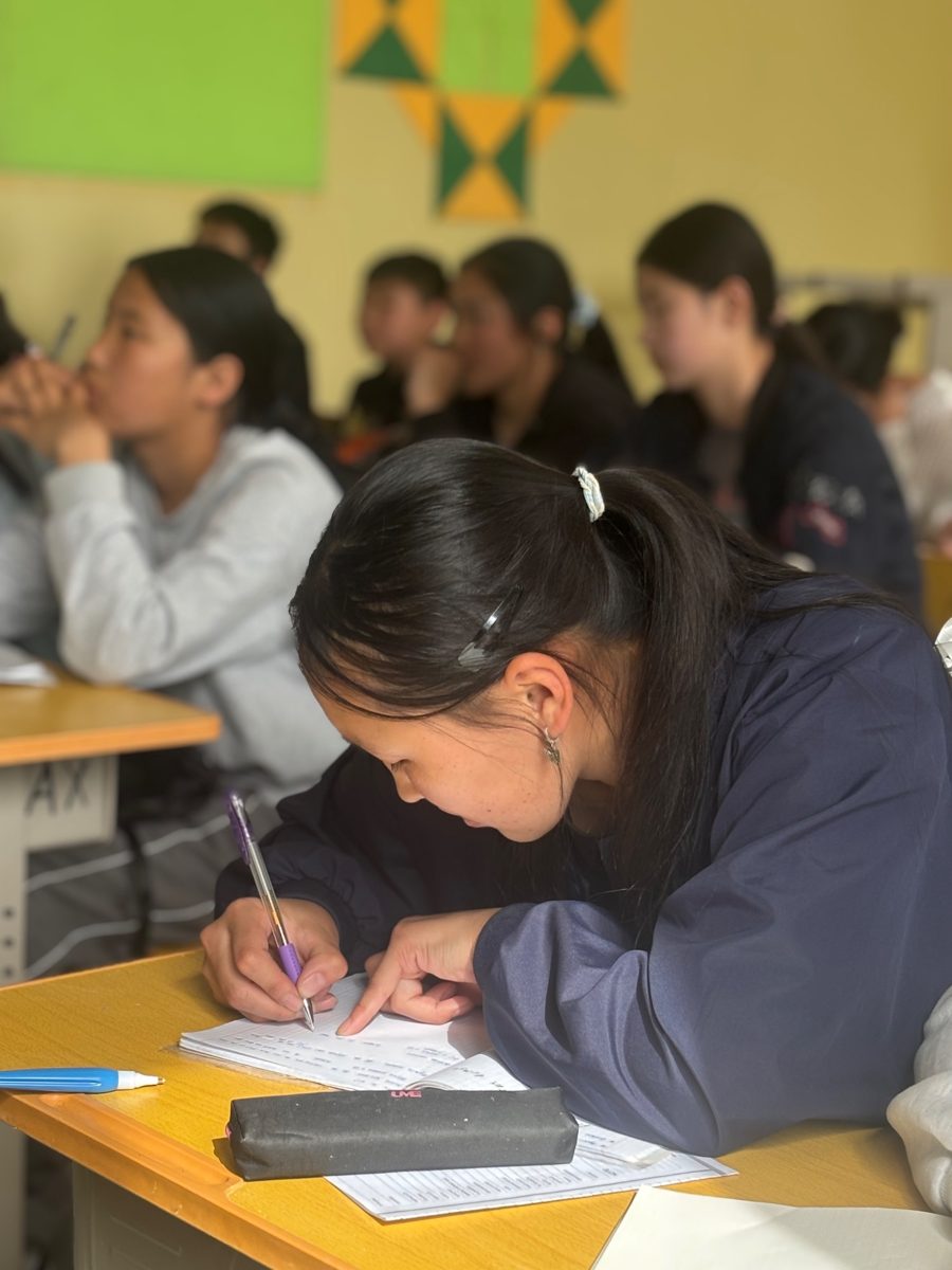 A student taking notes in class